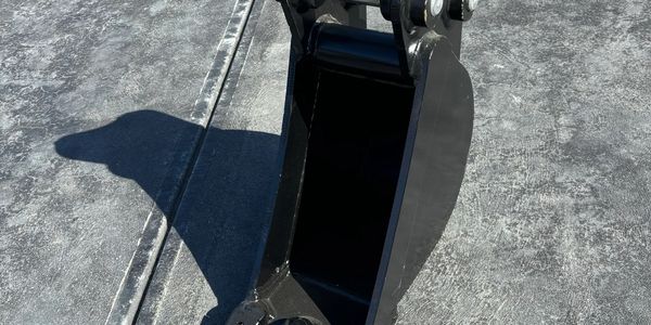 Excavator bucket attachment