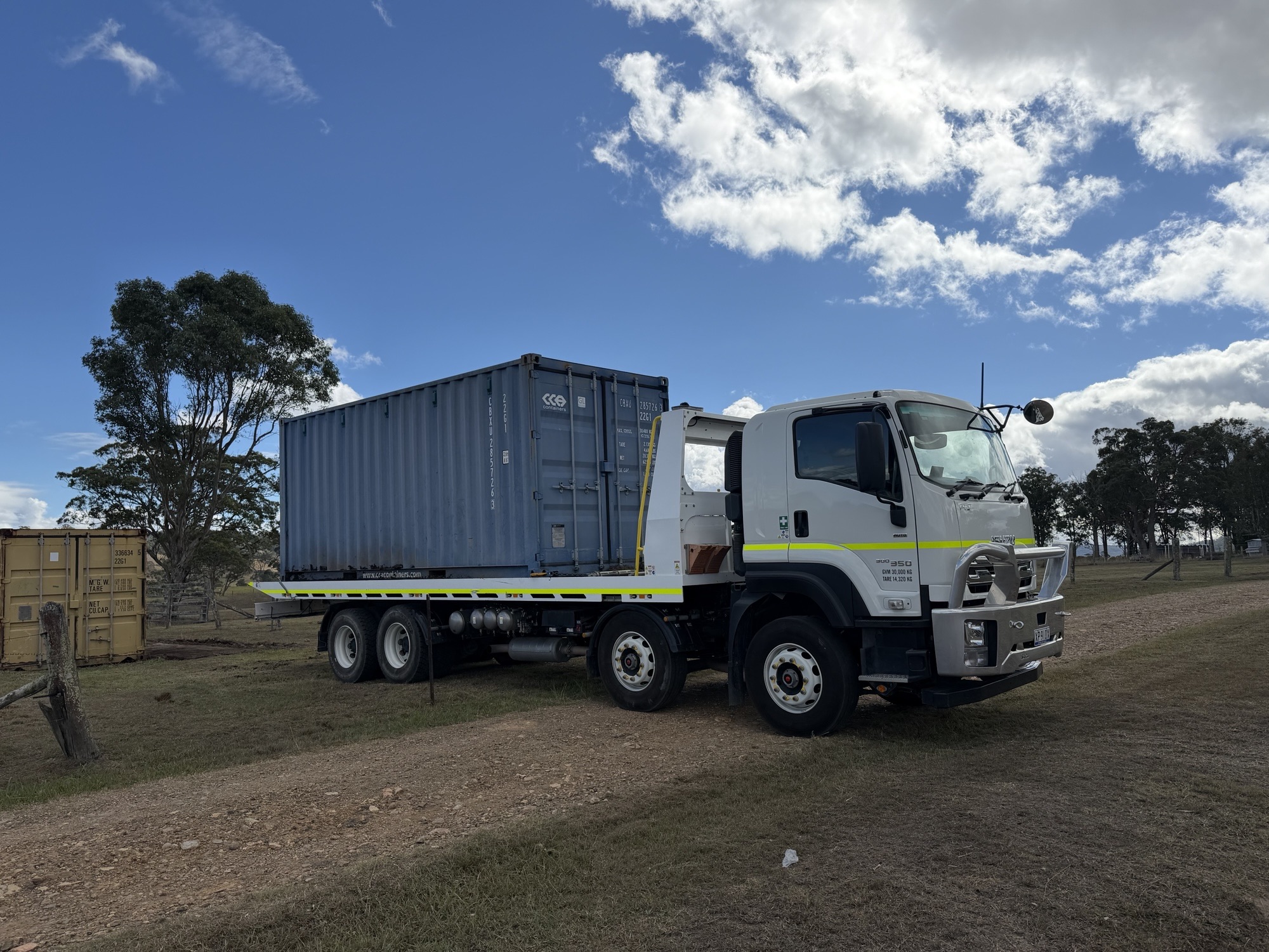 20ft shipping container loaded on Equip Hire tilt tray