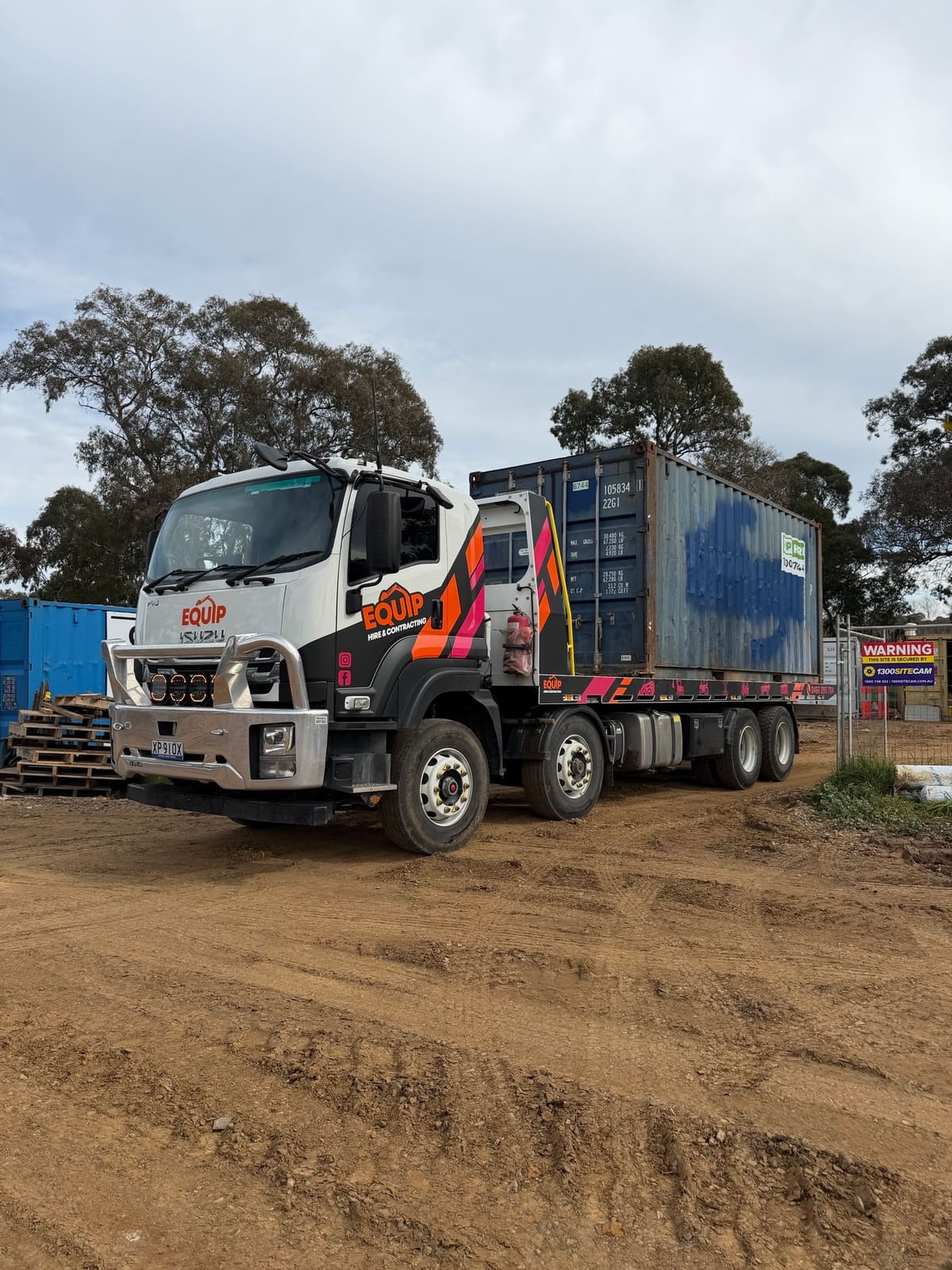 Shipping container delivered to building site by Equip Hire tilt tray in Salisbury