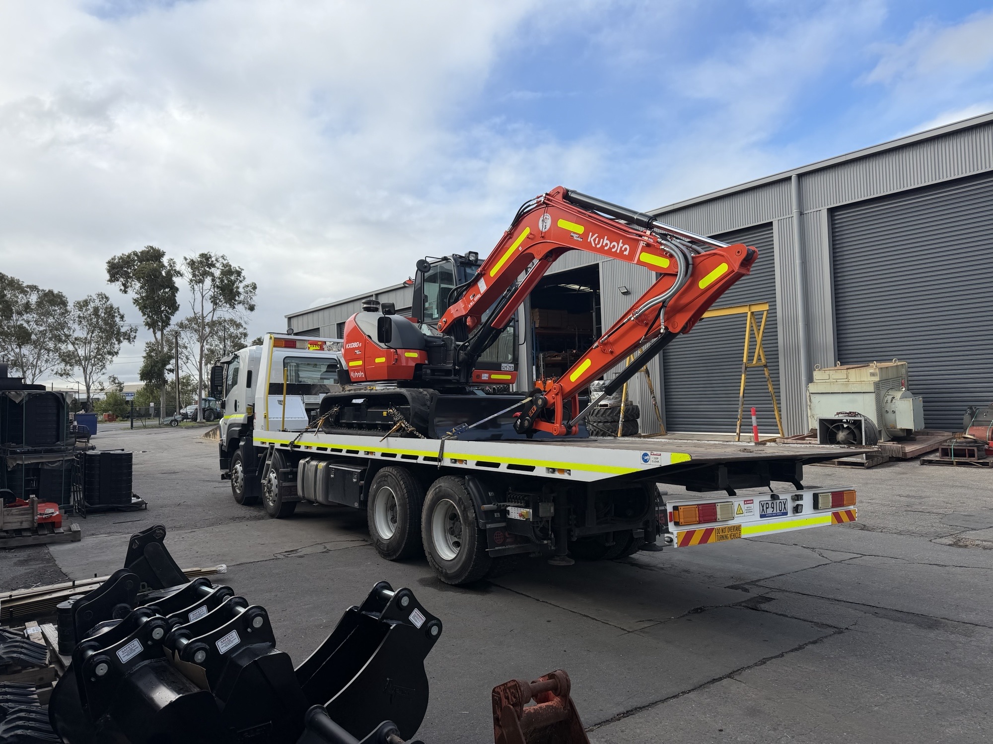 Kubota excavator loaded on tilt tray