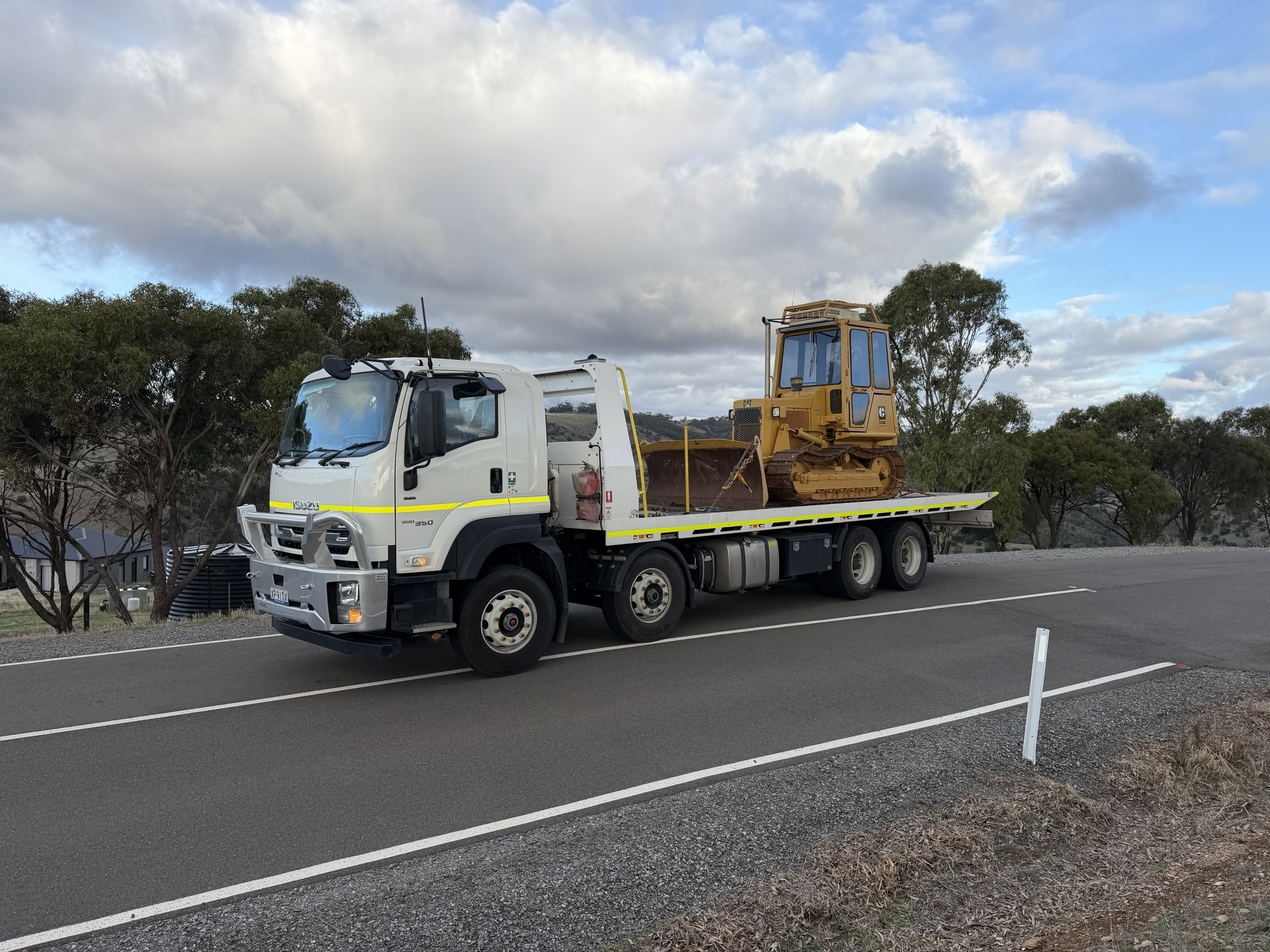 Bulldozer loaded on Equip Hire tilt tray for transport in South Australia