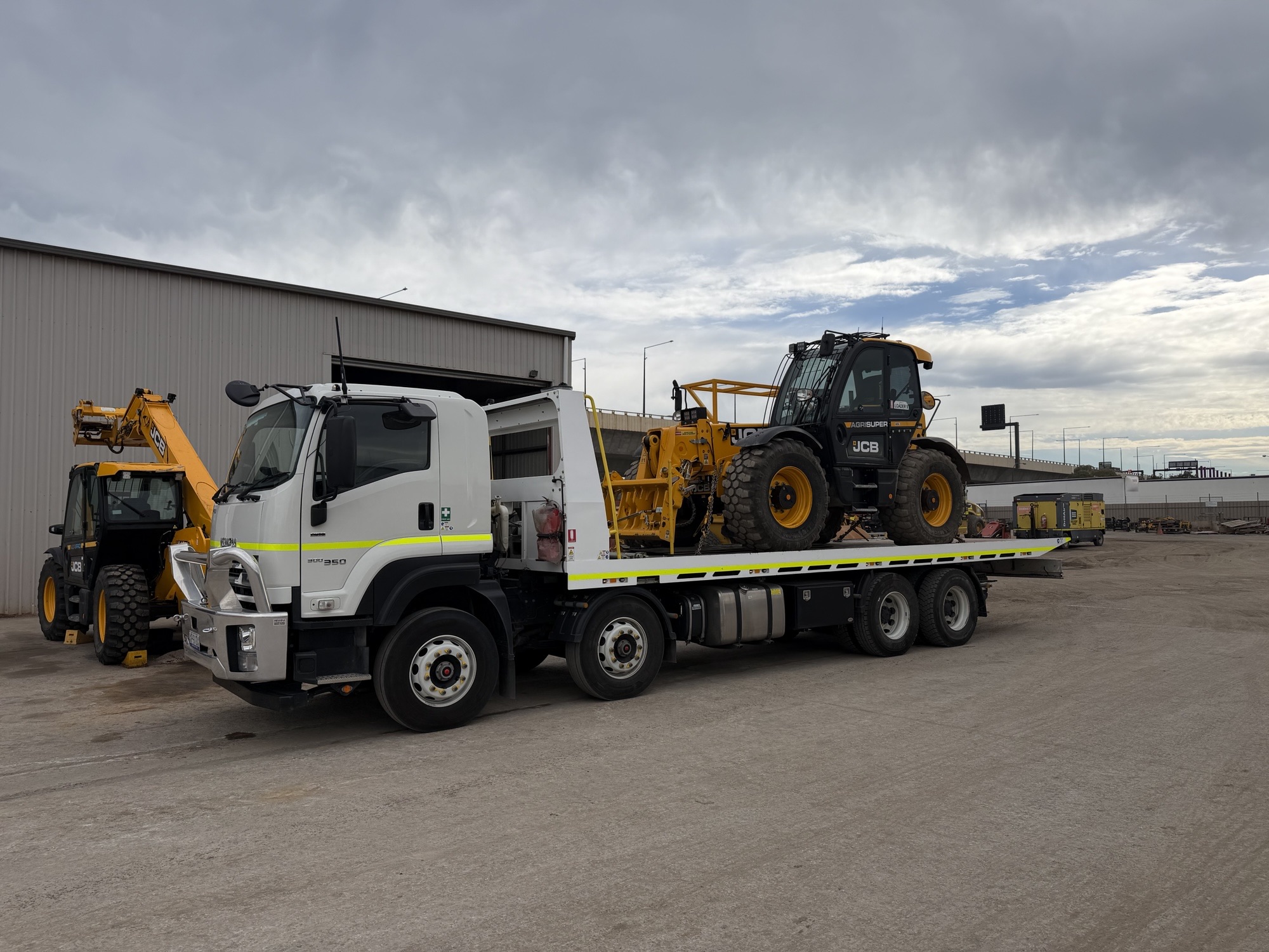 JCB telehandler loaded on tilt tray for Adelaide machinery transport